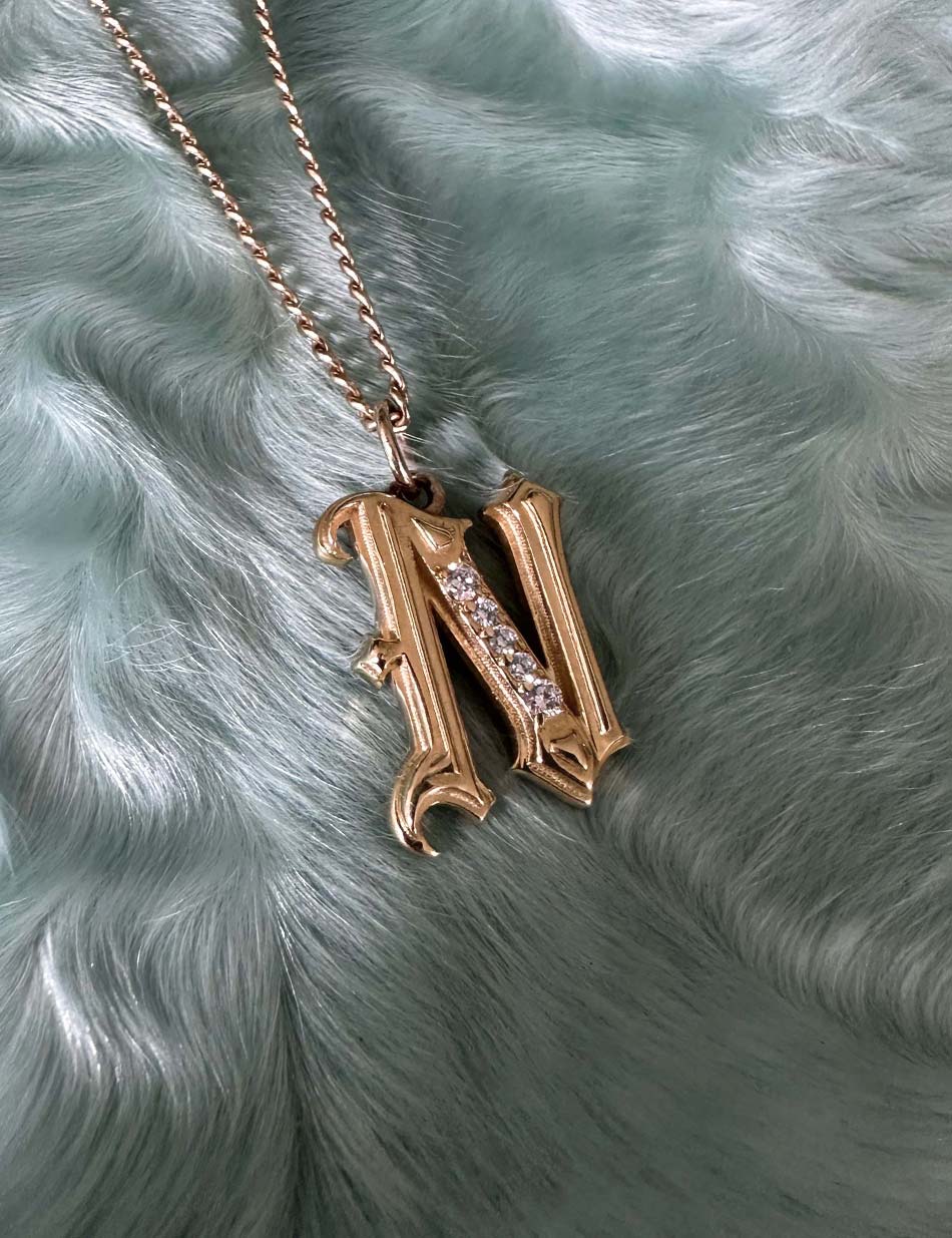 Gold Gothic Initial jewelry charm pendant with monogram "N" with diamonds by honey drip.