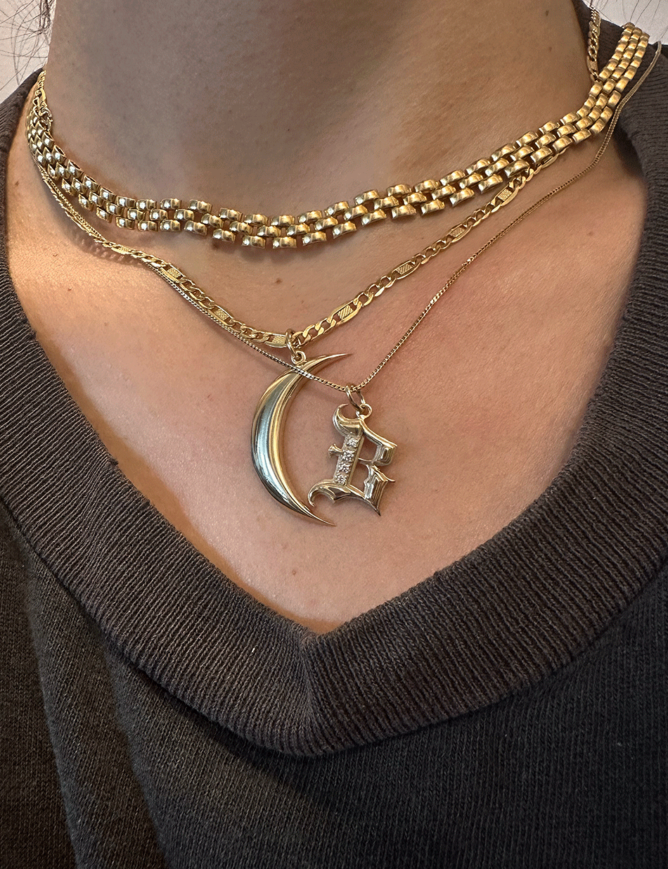 Crescent moon charm pendants in 14k gold with gothic initial jewelry by honey drip.