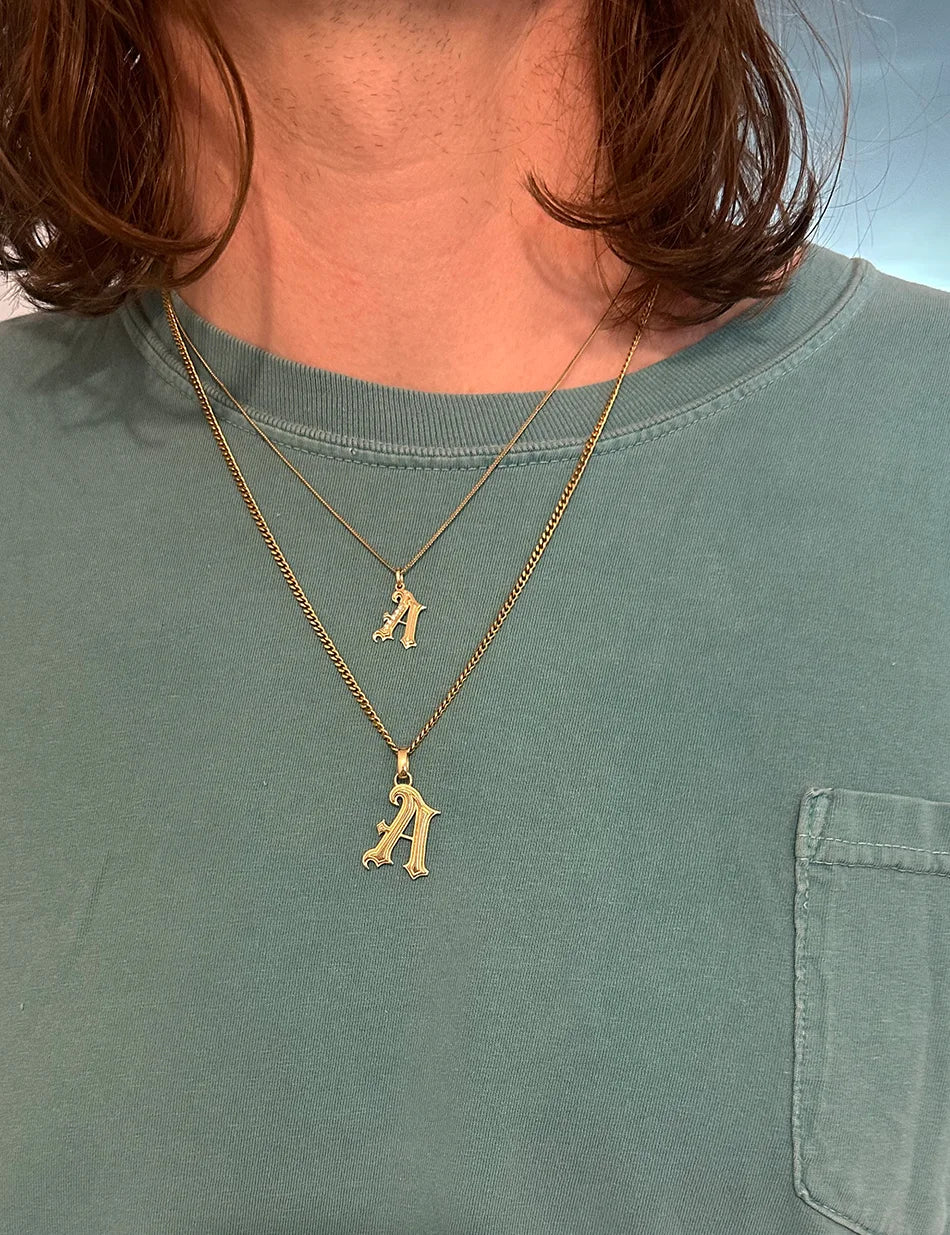 Gothic initial charm pendant necklaces available in two sizes by honey drip jewelry.