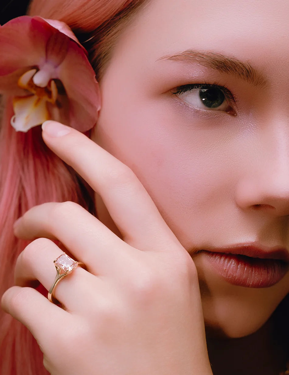 model Ella from No Inc. Agency wearing radiant cut pink diamond engagement ring in 14k gold by honey drip jewelry.