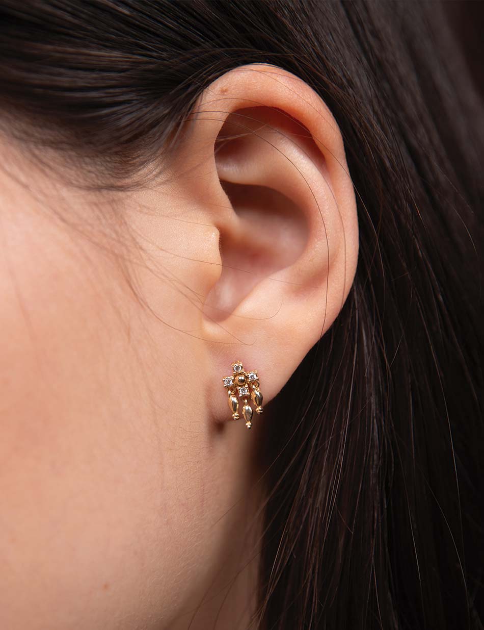 Edgy 14k gold and diamond tassel earring for helix piercings; luxury fringe stud with white diamond cluster.