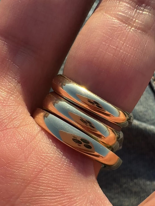 3 gold rings worn on the hands designed with white diamond studded spikes. Fine jewelry for those looking for elevated rings that reflect their subculture aesthetics.