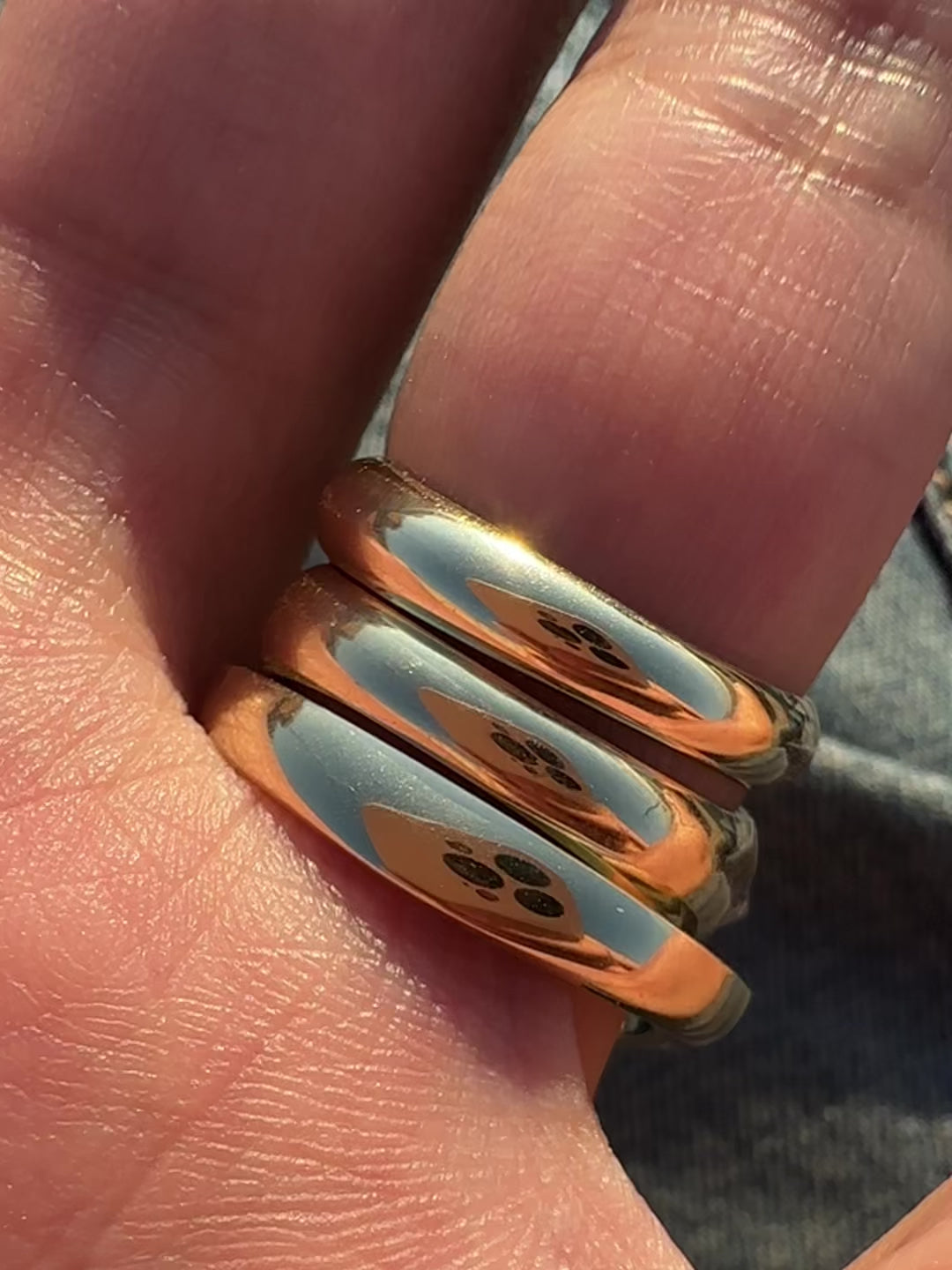 3 gold rings worn on the hands designed with white diamond studded spikes. Fine jewelry for those looking for elevated rings that reflect their subculture aesthetics.