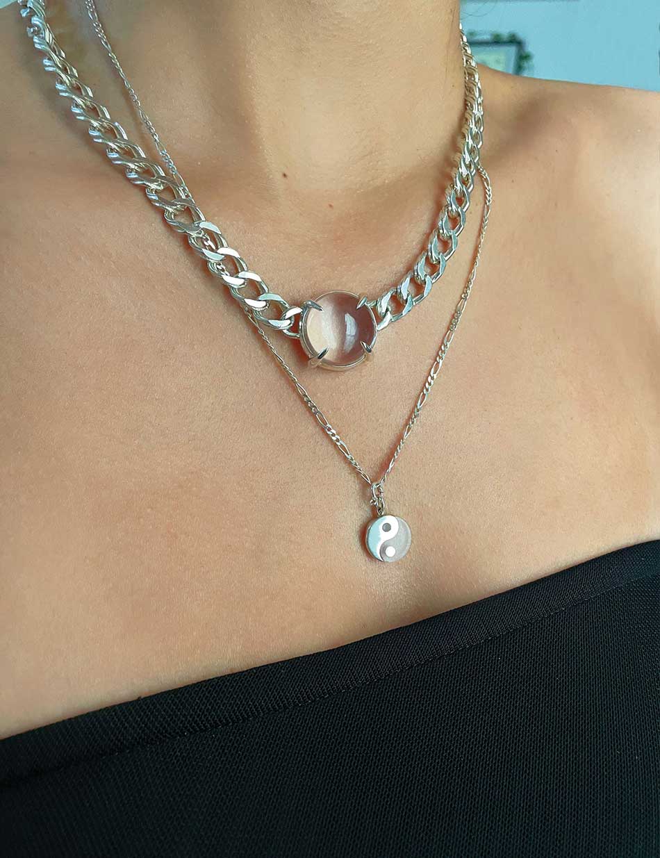 A set of necklaces by HONEY DRIP NYC, in sterling silver and quartz crystal