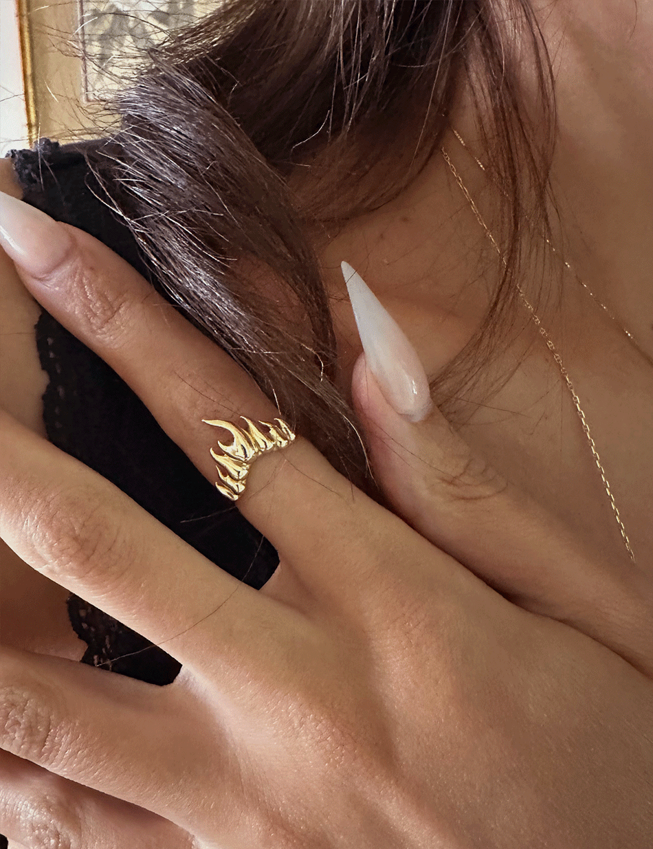 The fire flames ring in 14k solid gold by Honey Drip Jewelry.