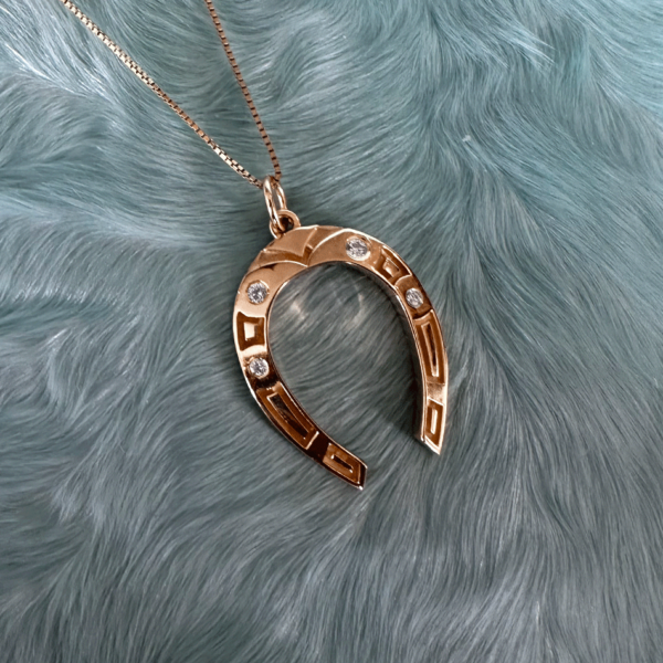 Lucky Horseshoe charm pendant in 14k gold & white diamonds by Honey Drip Jewelry