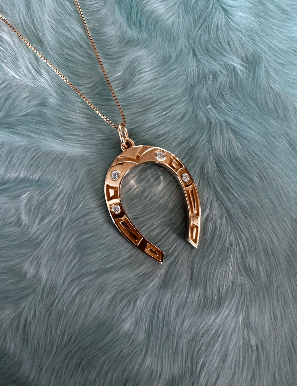 Lucky Horseshoe charm pendant in 14k gold & white diamonds by Honey Drip Jewelry