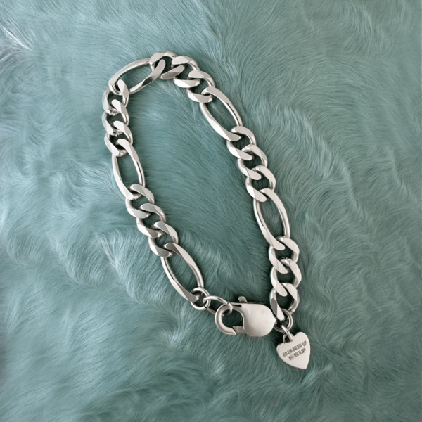 Silver Figaro chain bracelet by honey drip jewelry.