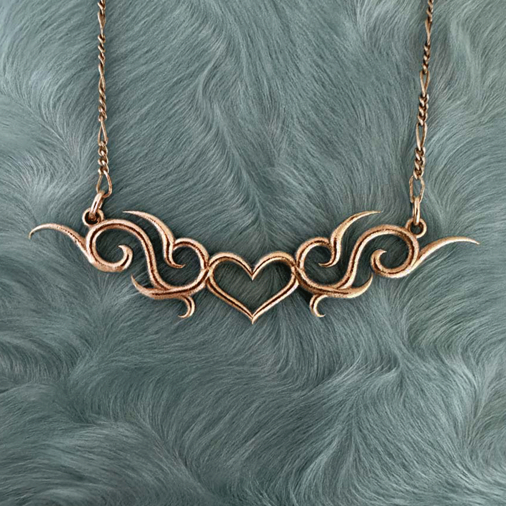 tribal heart tramp stamp tattoo necklace in 14k gold or sterling silver by honey drip jewelry.