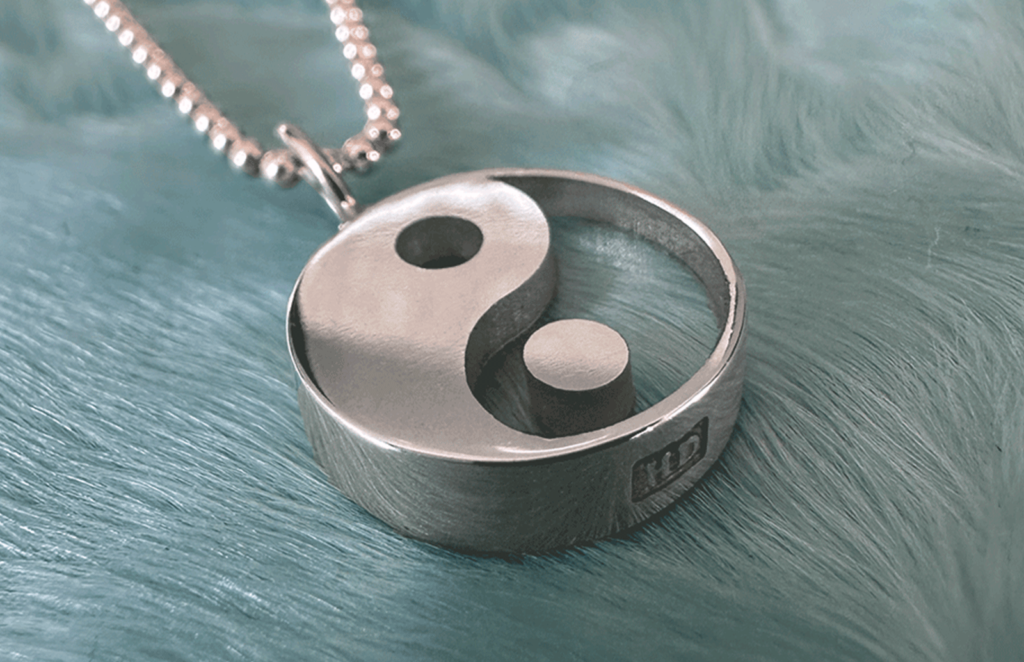 Yin yang charm pendant in sterling silver by honey drip jewelry.