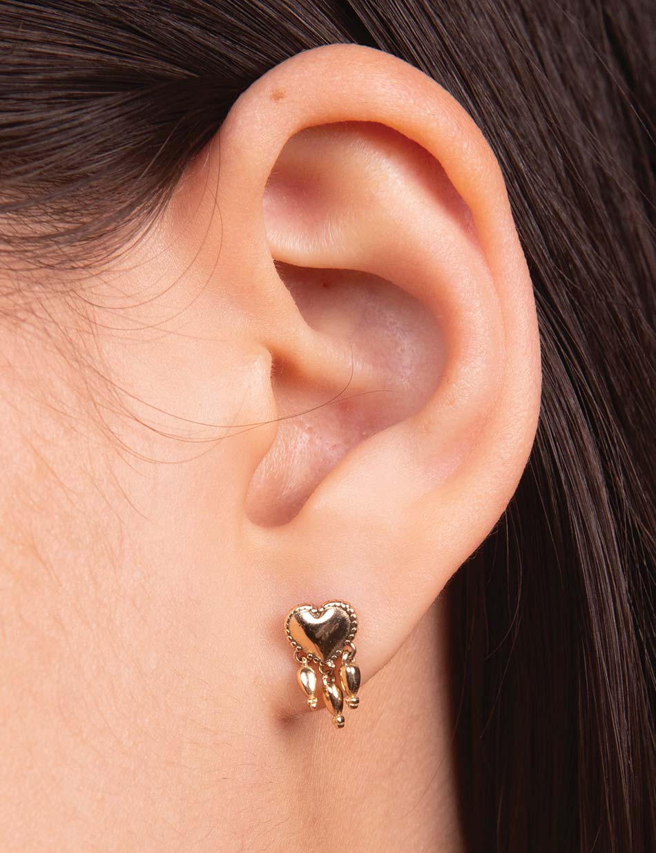 The bleeding sacred heart tassel stud earring by HONEY DRIP NYC in 14k gold.