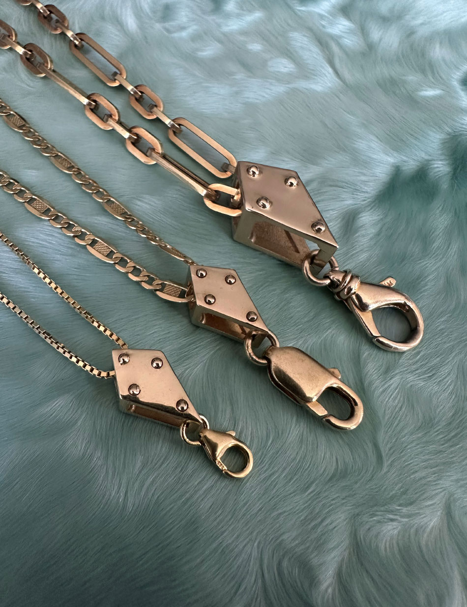 The one-of-a-kind stacking crane blocks in 14k gold with vintage clasps.